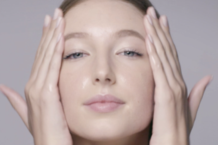 Image of a woman washing her face