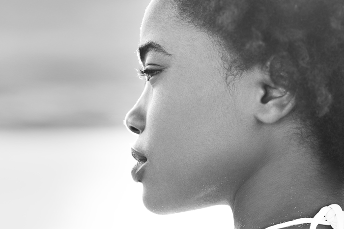 Black and white side image of a woman's face