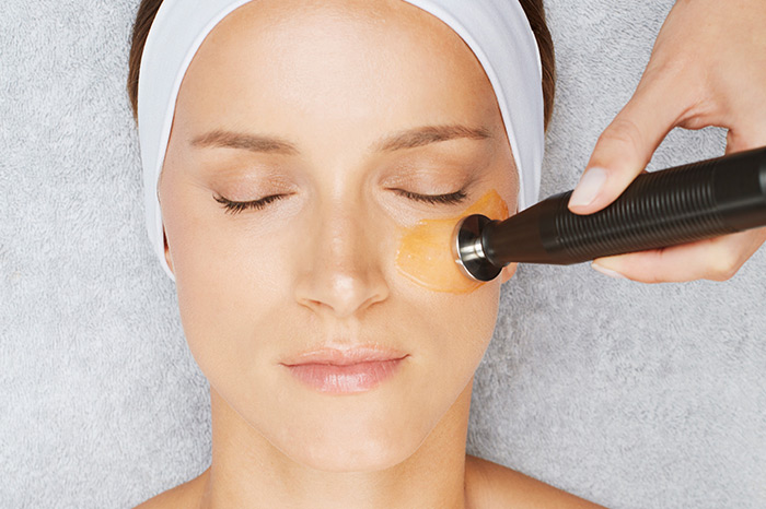 Woman receiving under-eye treatment with Environ DF technology